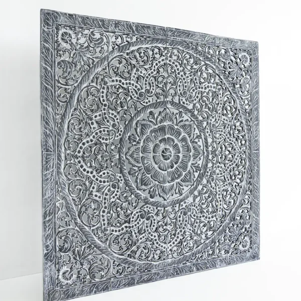 Mandala wood carving on wall finished in dark grey