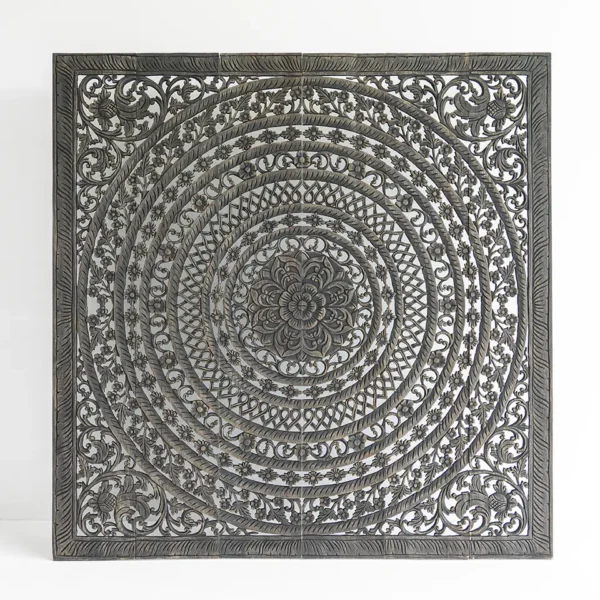 Intricately carved dark wooden panel with circular mandala design featuring multi-layered floral and geometric patterns