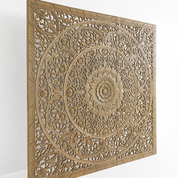 Side view of carved wooden headboard showing depth and texture of mandala design